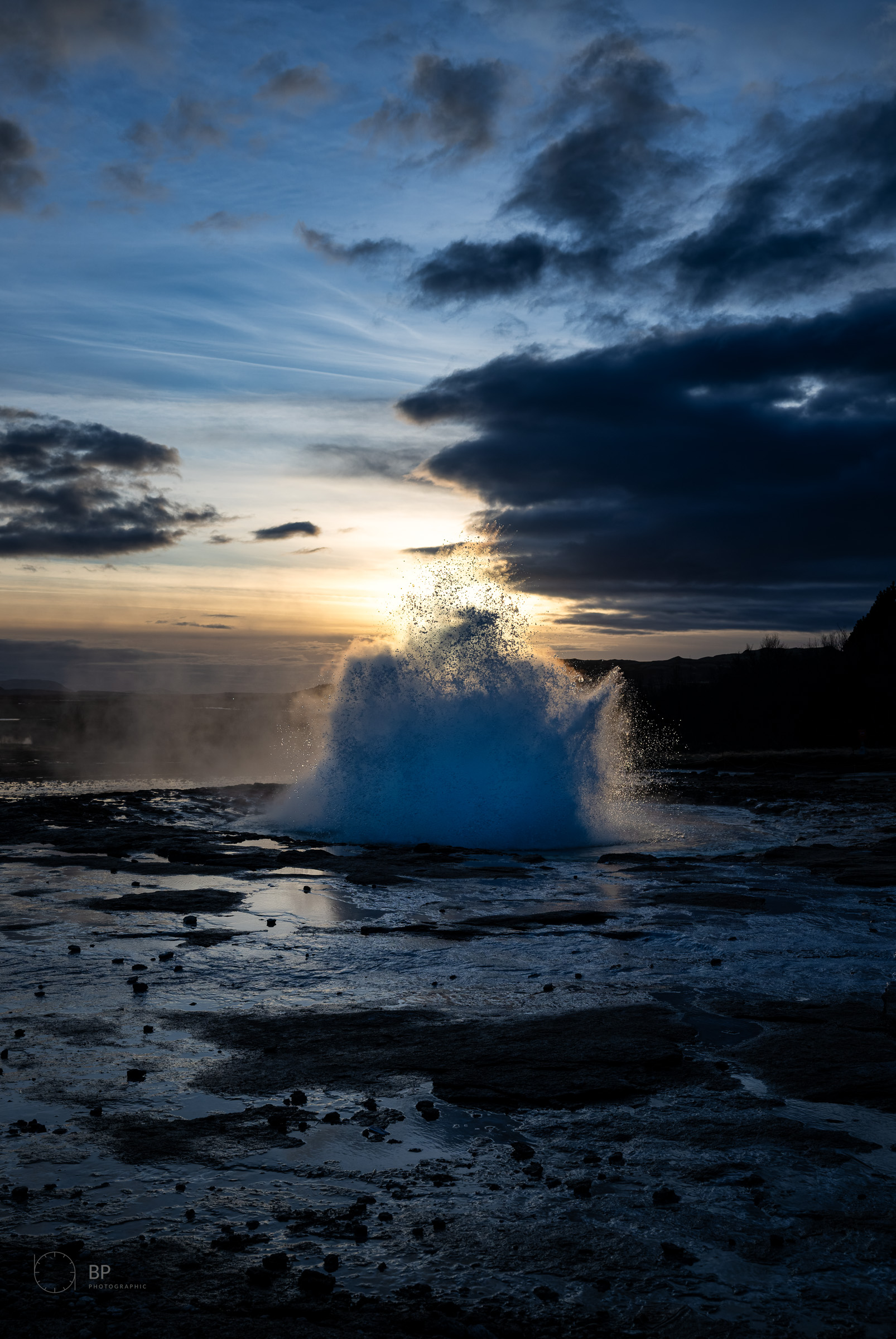 Strokkur geyser at sunset